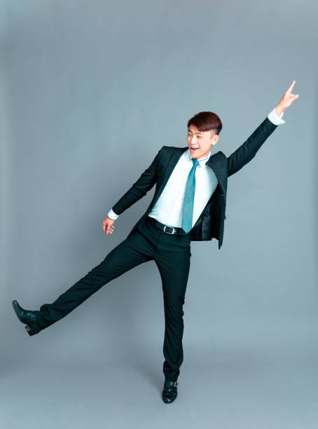 istock Happy young business man dancing in motion 1193432747