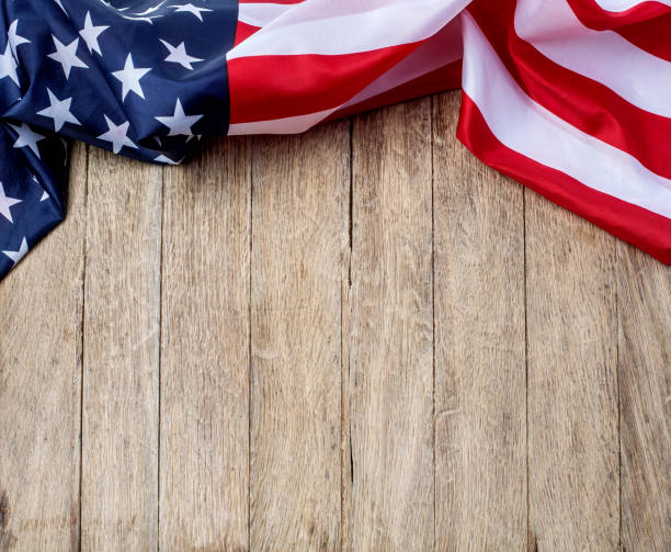 istock US flag on wooden background. 1193442787