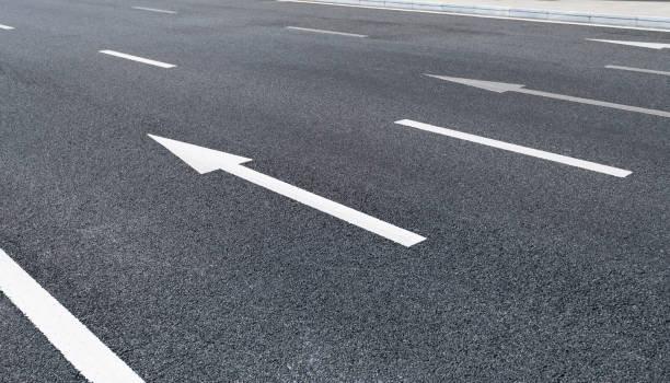 istock Arrow signs on asphalt road 1193442991