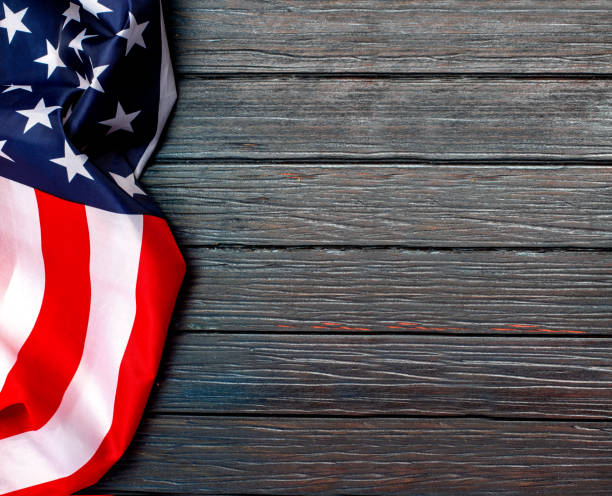 istock US flag on wooden background. 1193443136