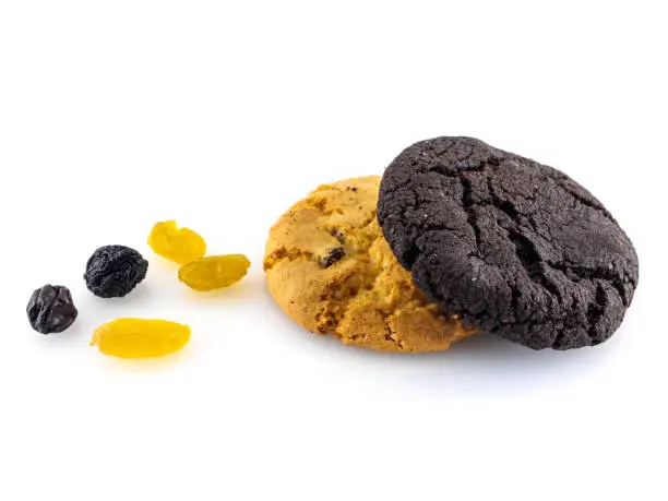 Two kinds of cookies and raisins on a white background.