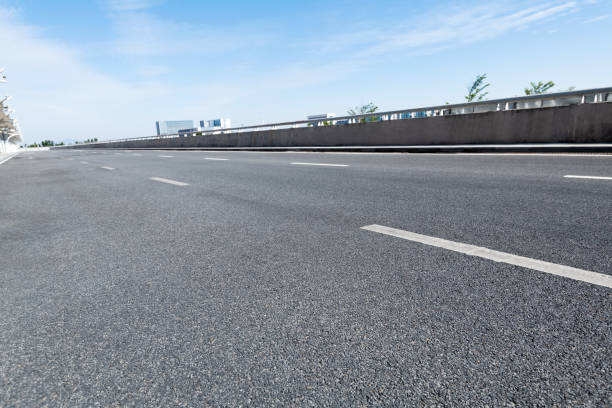istock Empty asphalt road with buildings in the city 1193444172