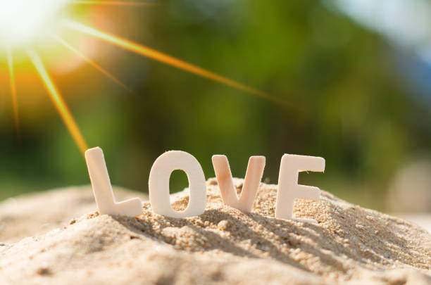 istock LOVE alphabets place on sand pile 1193445328