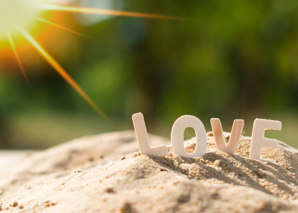 istock LOVE alphabets place on sand pile 1193445348