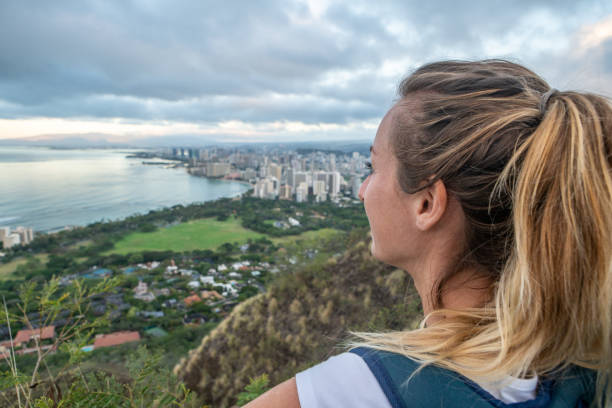 istock Young woman from mountain top contemplating Honolulu 1193445656