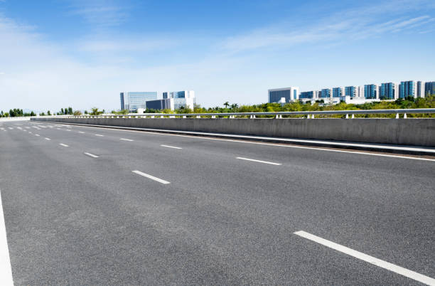 istock Empty asphalt road with buildings in the city 1193445840