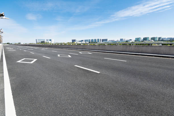 istock Empty asphalt road with buildings in the city 1193449200