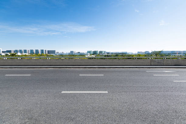 istock Empty asphalt road with buildings in the city 1193450288