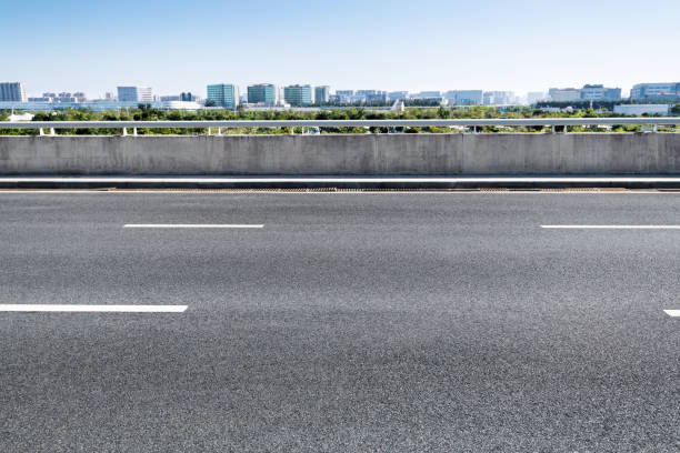 istock Empty asphalt road with buildings in the city 1193451451