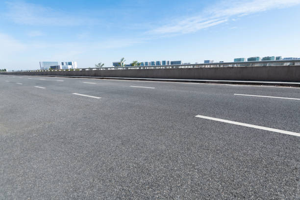 istock Empty asphalt road with buildings in the city 1193451562