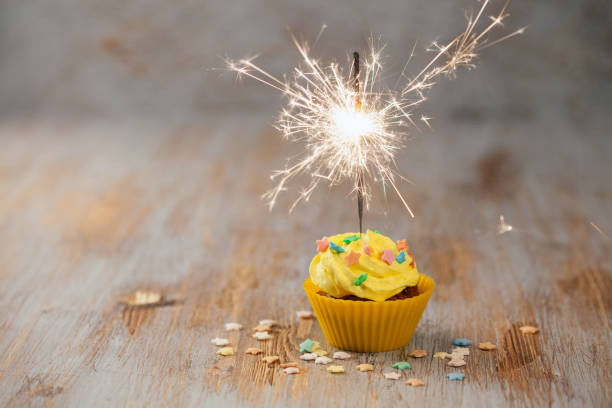 istock Sweet cupcake with candles 1193451696