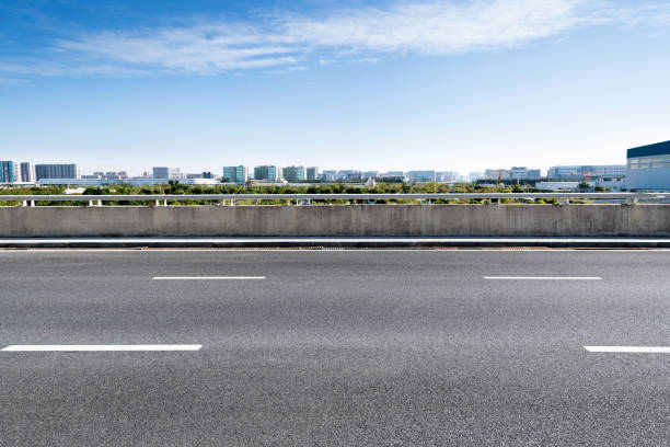 istock Empty asphalt road with buildings in the city 1193451886