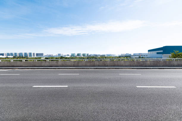 istock Empty asphalt road with buildings in the city 1193451996