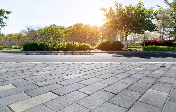 istock Brick sidewalk and asphalt street 1193452525