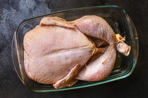 istock raw chicken in marinade (poultry, carcass meat) menu concept. food background. top view. copy space 1193452665
