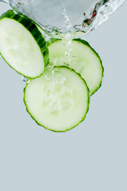istock Cucumber slices falling into the water 1193452747