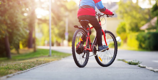 istock child on a bicycle in the evening 1193453648