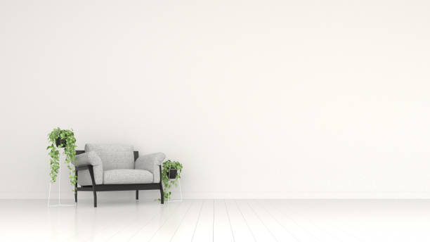 istock Interior wall mock up with grey sofa, with hanging plants in vase on empty white background. 3D rendering. 1193454908
