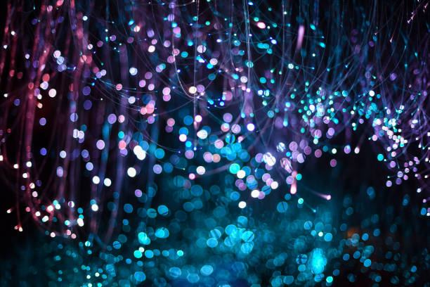 istock Abstract blur gold multicolor sparkle bokeh background. Dark background. Festive christmas background. Celebration party 1193454911