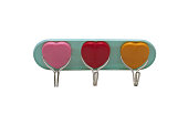 Image of plastic hooks for clothes in the form of hearts isolated on a white background