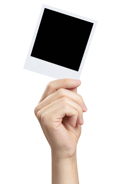 Hand holding photocard on white