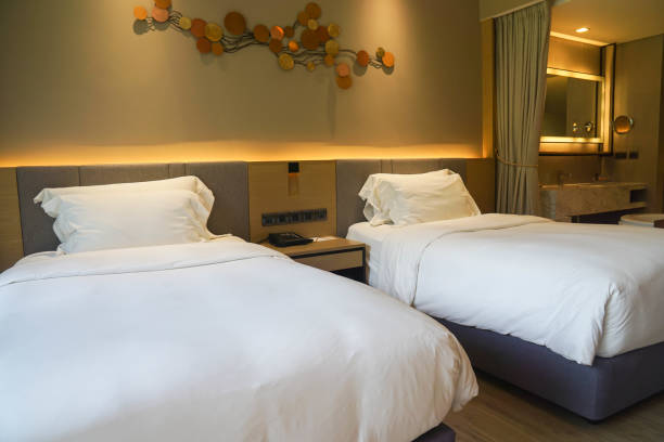 istock white comfy twin bed in luxury hotel for rest in holidays 1193456065