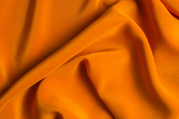 istock Golden silk or satin luxury fabric texture can use as abstract background. 1193456296