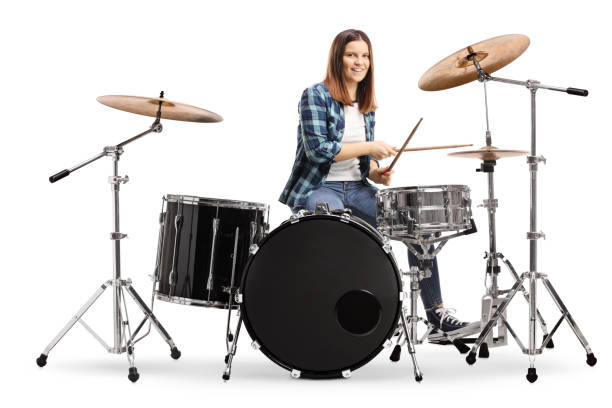 istock Young female learning to play drums 1193457883