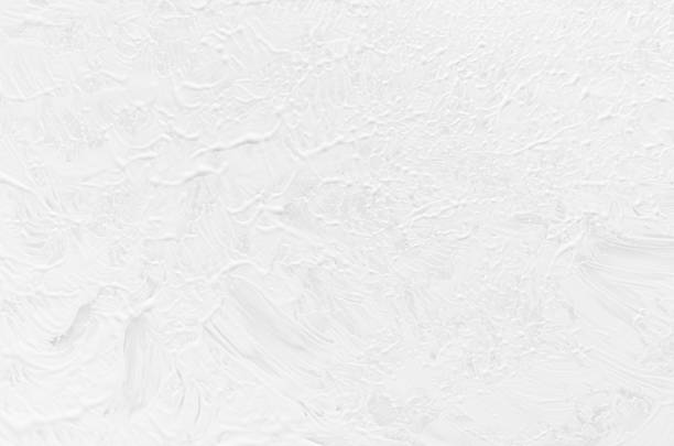 istock Soft light white fluid paint background with random print splash brush strokes as abstract texture. 1193458044