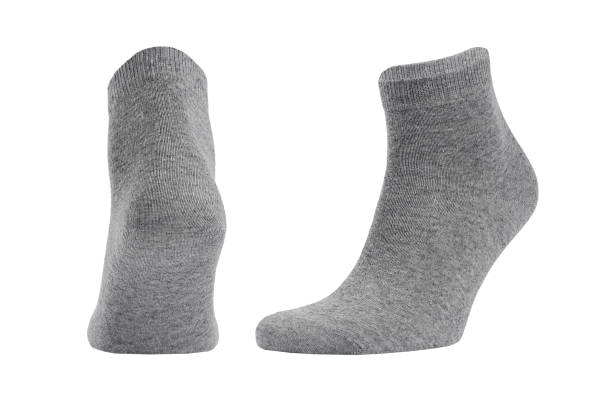 istock Blank grey cotton medium socks on invisible foot isolated on white background as mock up for advertising, branding, design, back and side view, template. 1193458047