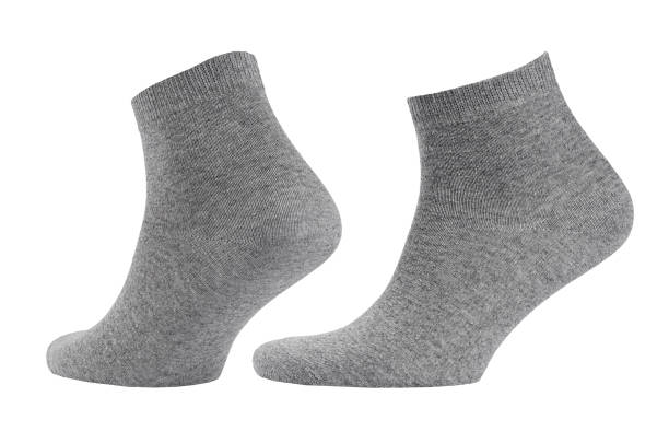 istock Blank grey  cotton medium socks on invisible foot isolated on white background as mock up for advertising, branding, design, front side, side view, template. 1193459127