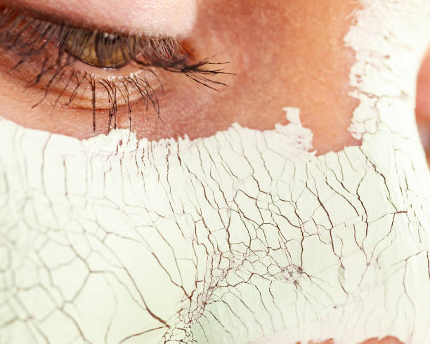 istock Girl with mud mask on face 1193460762