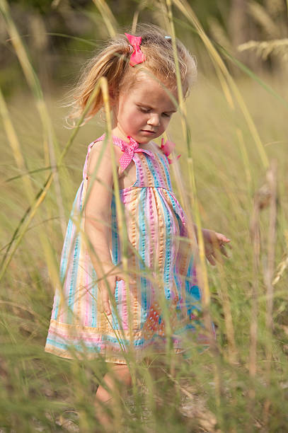 istock Girl in the sea grass 119346216
