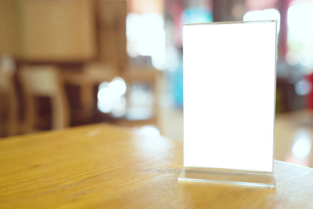 istock Mock up Menu frame standing on wood table in Bar restaurant cafe. space for text 1193463045