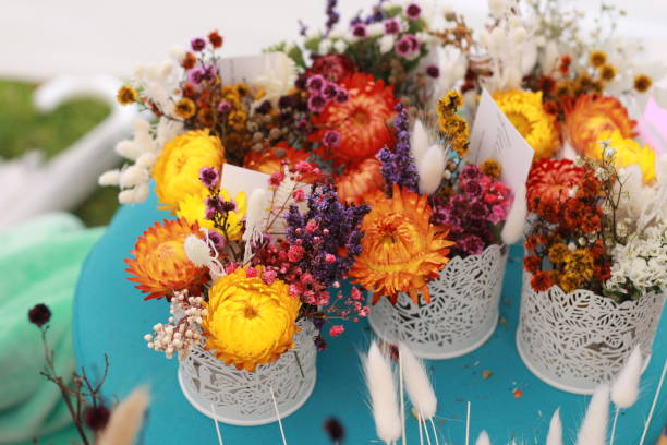 istock group arts and crafts activity making a natural colorful flower decoration using multi colored spring time flowers 1193464948
