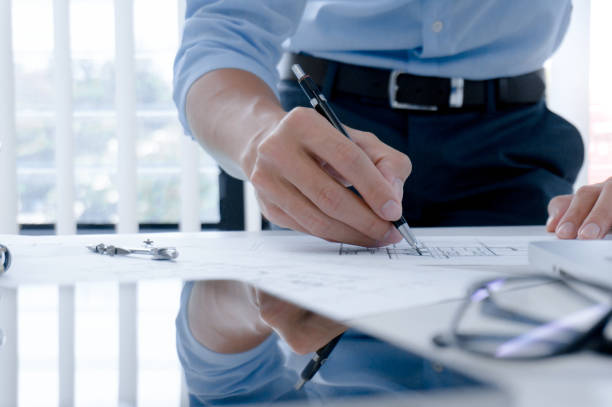 istock Colleagues interior designer Corporate Achievement Planning Design on blueprint Teamwork Concept with compasse. 1193465000