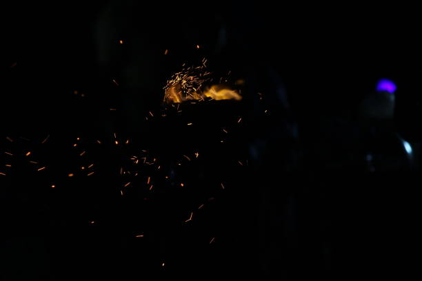 istock Corn being cooked on coal near beach with some fire spark . A corn roaster sparkling fire in the shores of Marina Beach, Chennai, India on night 1193466852