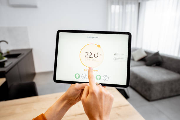 istock Controlling heating with a digital tablet at home 1193467451
