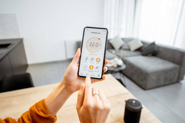 istock Controlling heating with a smart phone at home 1193467471