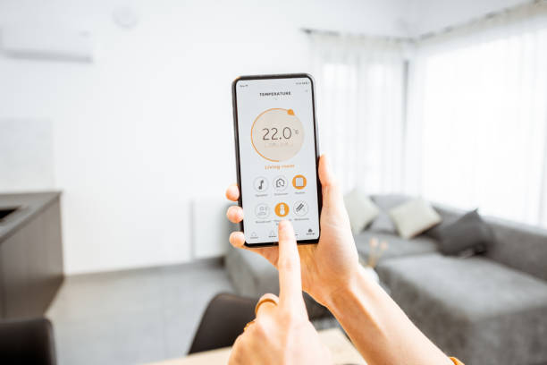 istock Controlling heating with a smart phone at home 1193467498