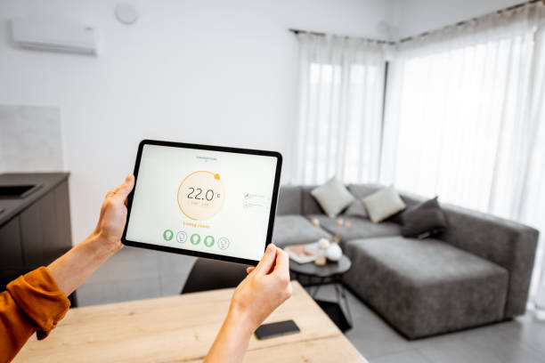 istock Controlling heating with a digital tablet at home 1193467499