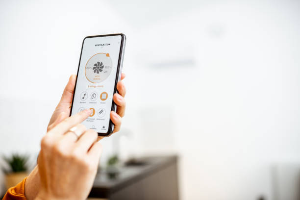 istock Controlling ventilation with a smart phone at home 1193467545