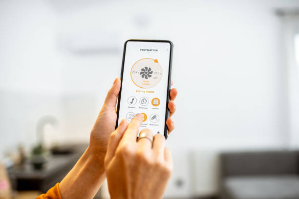 istock Controlling ventilation with a smart phone at home 1193467569