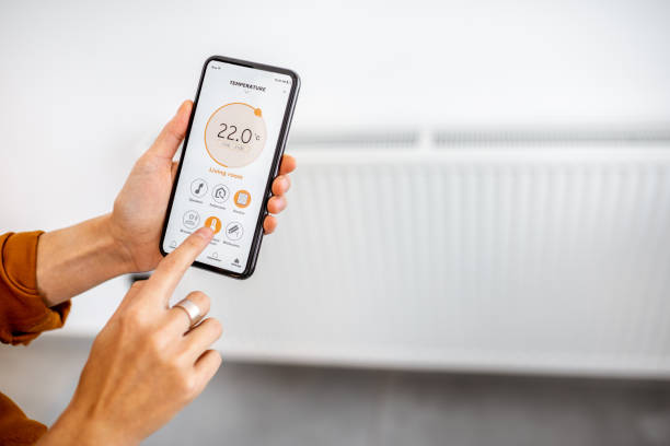 istock Controlling heating with a smart phone at home 1193467591