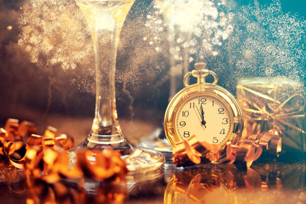istock New Year's at midnight - Old clock with holiday lights 1193468666