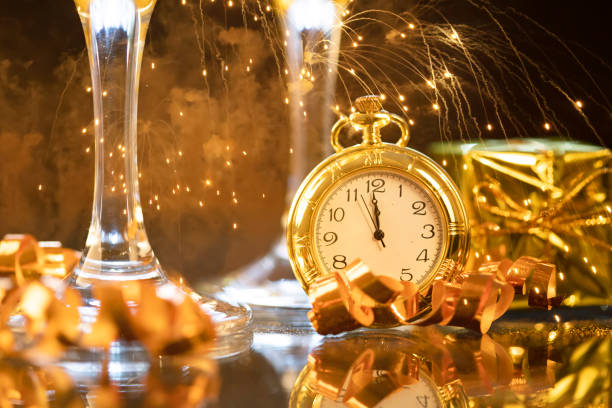 istock New Year's at midnight - Old clock with holiday lights 1193469069