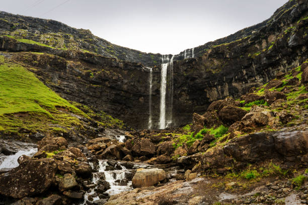 Fossa waterfall panorama with green hills around. Eysturoy island, Faroe. Fossa waterfall panorama eysturoy stock pictures, royalty-free photos & images