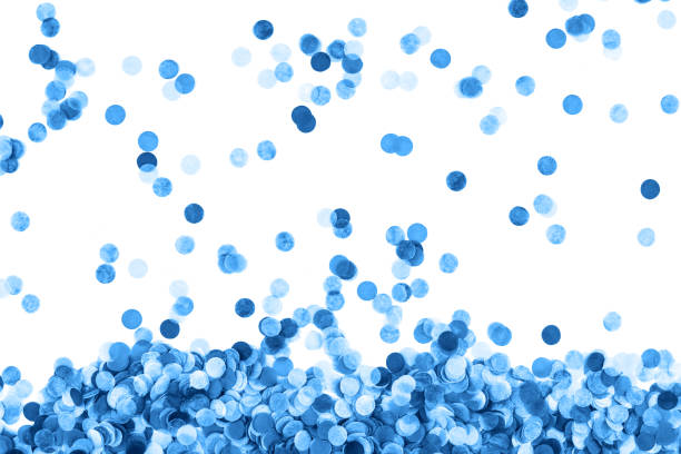 Festive blue confetti background. Flat lay style.