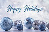 Festive blue and silver balls, Christmas decorations on a shiny background. Happy Holidays.