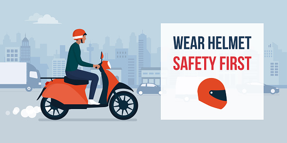 Wear helmet when riding a motorbike, man riding a moped with helmet and city street